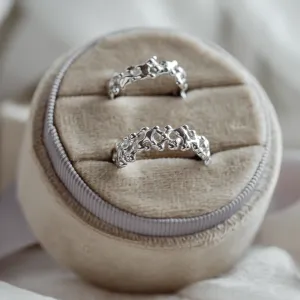Close-up of the NALANI wedding ring pair and organic details