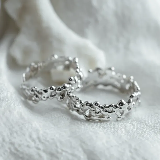 Close-up of NALANI wedding rings highlighting their organic elements