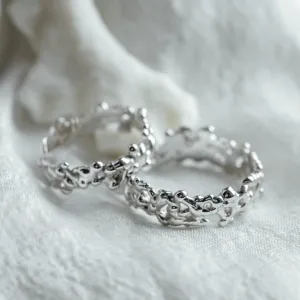 Close-up of NALANI wedding rings highlighting their organic elements