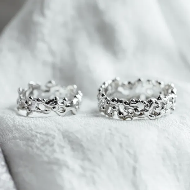 NALANI avant-garde wedding rings with organic elements, shown as a pair