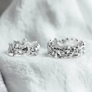 NALANI avant-garde wedding rings with organic elements, shown as a pair