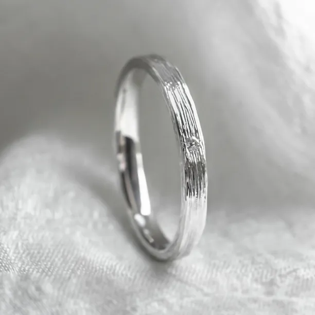 Original wedding ring with tree bark surface NIXON Image