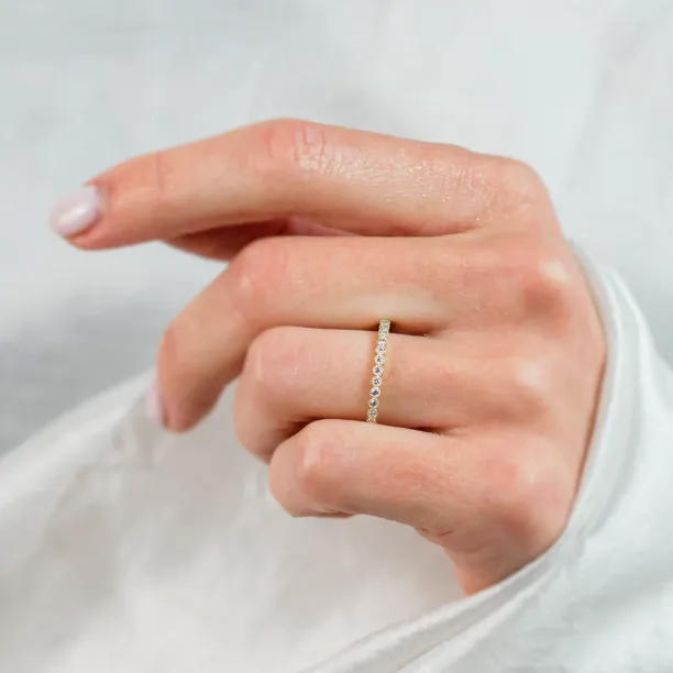 CHRISTINE gold diamond ring worn on a hand