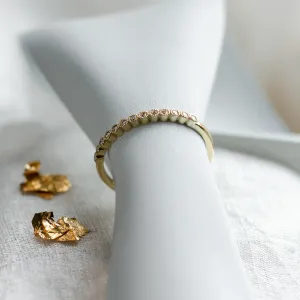 Angled view of the diamond-set band on the CHRISTINE ring