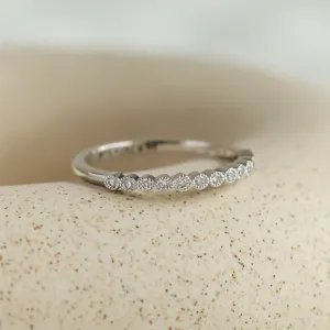 Angled view of the CHRISTINE gold ring with diamonds in half eternity design