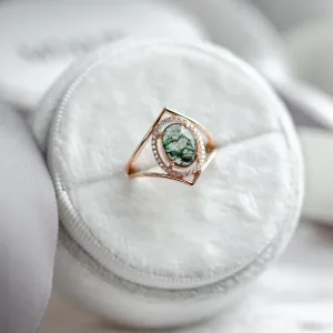 Angled view of the PINIA gold ring with moss agate and diamonds