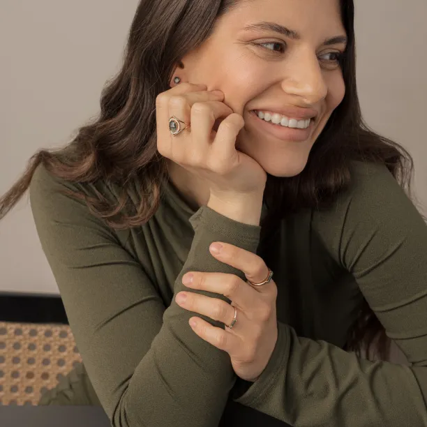 PINIA gold ring with moss agate and diamonds worn on the hand