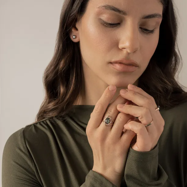 PINIA gold ring with moss agate and diamonds worn on the hand