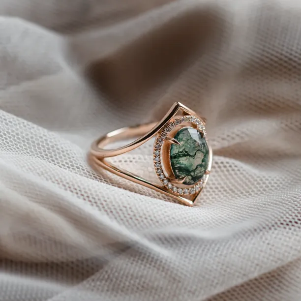 Close-up of the gold PINIA ring with moss agate and diamonds