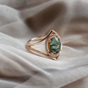 Close-up of the gold PINIA ring with moss agate and diamonds