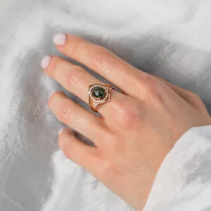 Gold PINIA ring with moss agate and diamonds worn on a hand