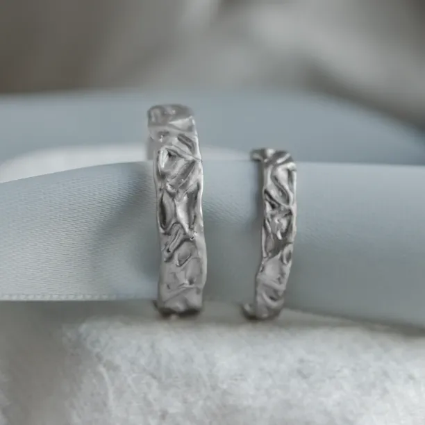 ANJA wedding rings displayed upright to show their organic texture
