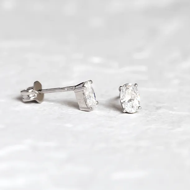 CAROLYNE gold earrings with oval moissanites, showing the side and backs