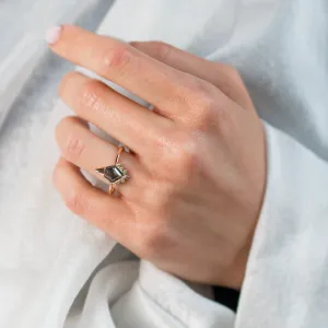 ADIRA engagement ring with salt and pepper diamond worn on a hand