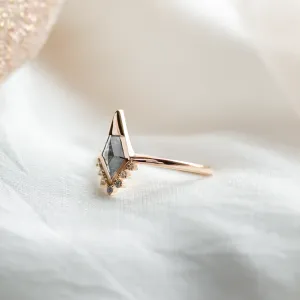 Side view of ADIRA engagement ring showing its salt and pepper diamond and side diamonds