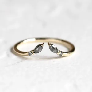 Close-up of the ADA open ring with salt and pepper diamonds