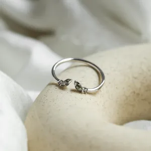 Angled view of the ADA open ring with salt and pepper diamonds