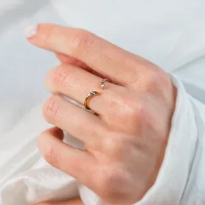 Gold open ring with salt and pepper diamonds ADA worn on a hand