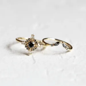 Gold open ring with salt and pepper diamonds ADA beside another ring