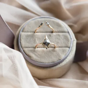 Gold open ring with salt and pepper diamonds ADA displayed with another ring