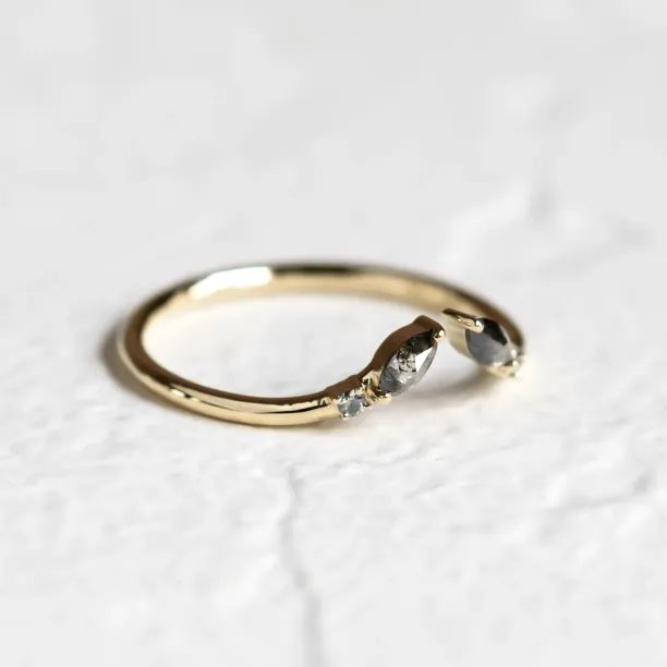 Close-up side view of the gold open ring with salt and pepper diamonds ADA