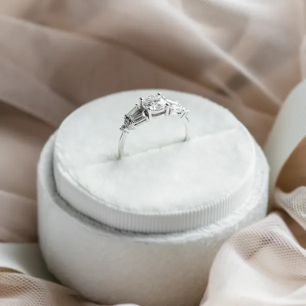 Angled view of the GINNY ring highlighting its central moissanite