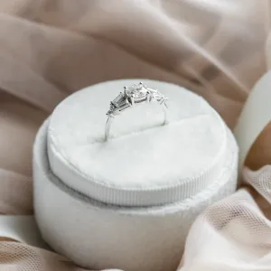 Angled view of the GINNY ring highlighting its central moissanite