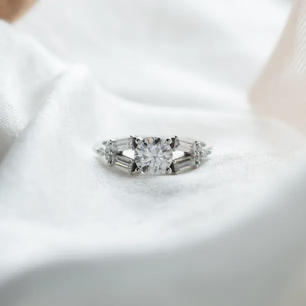 GINNY atypical ring with moissanites in a clear front view