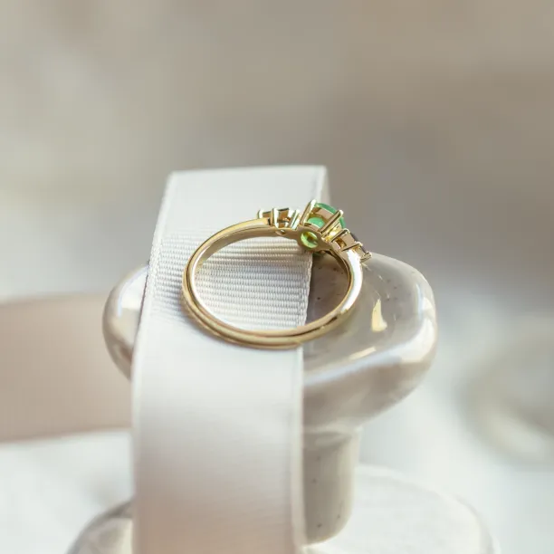 Rear view of the KIM gold ring showing the inside of its gemstone settings