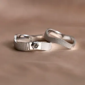 JACKLYN wedding rings in an angled view, highlighting the salt and pepper diamond