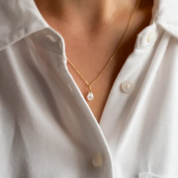 Gold necklace with pear moissanite NAOMI worn on the neck