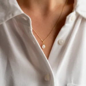 Gold necklace with pear moissanite NAOMI worn on the neck