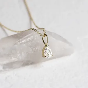 NAOMI necklace with pear moissanite in yellow gold, angled pendant detail