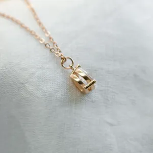 Close-up of the gold NAOMI necklace pendant and chain