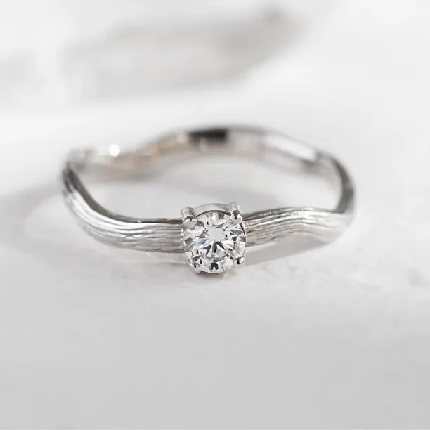 Atypical engagement ring with diamond and tree bark surface RIA Image