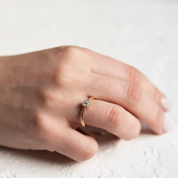 Atypical engagement ring with diamond and tree bark surface RIA Image