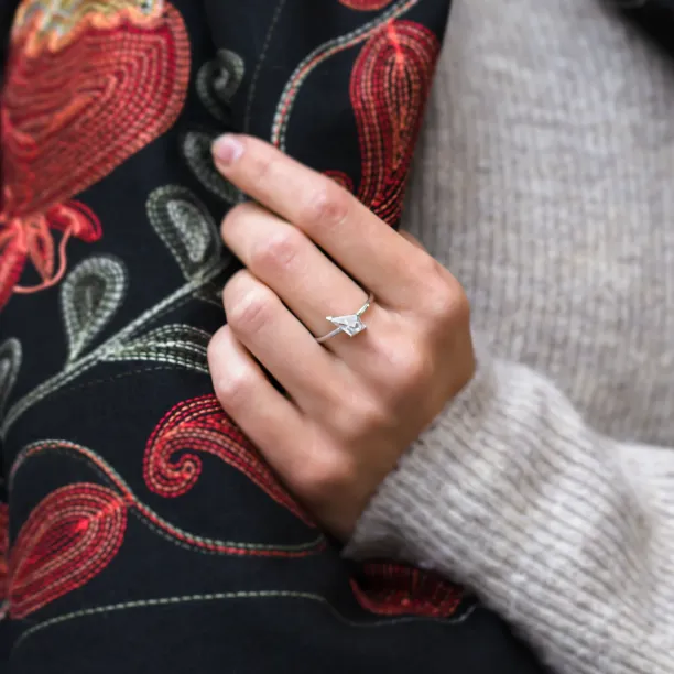 JODIE gold ring with kite moissanite worn on a hand