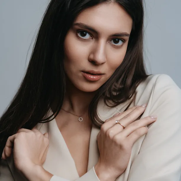 ISABELLA diamond engagement ring beside a woman's face
