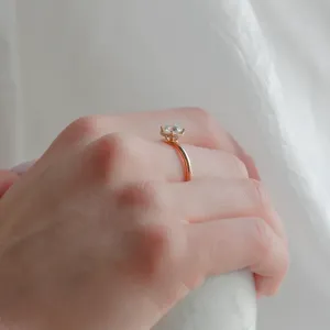 Side view of the ISABELLA diamond engagement ring worn on a hand