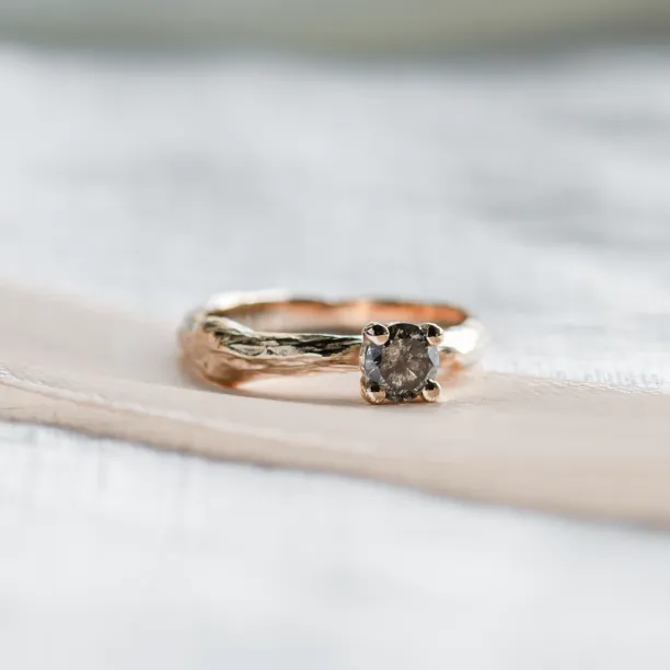 Close-up of the twig-shaped ring and its salt and pepper diamond