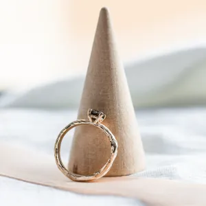 Side view of the twig-shaped ring showing the diamond setting