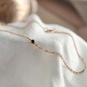 DUNCAN gold bracelet with a black diamond, shown in close-up
