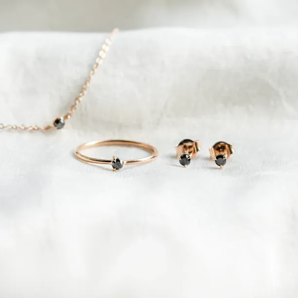 DUNCAN minimalist jewelry collection with natural black diamonds, including a ring, bracelet and earrings