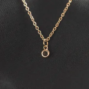 Close-up of the gold bezel pendant with black diamond