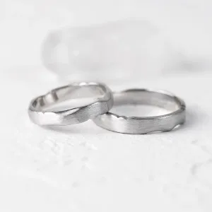 DANTE torn paper edge gold wedding bands shown together