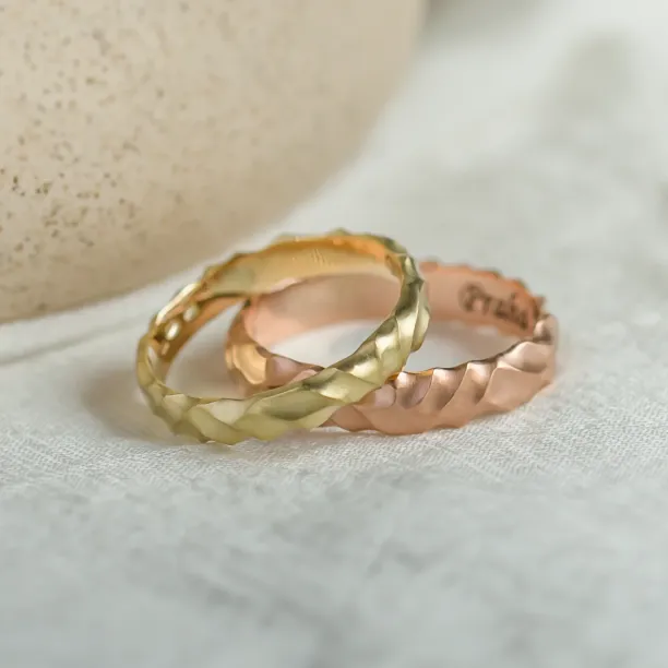 Pair of original engraved ROCK wedding rings with a 14K rose gold ring