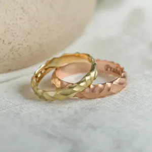 Pair of original engraved ROCK wedding rings with a 14K rose gold ring