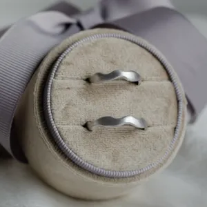 Pair of GOCCIO unusual wedding rings with irregular curved bands