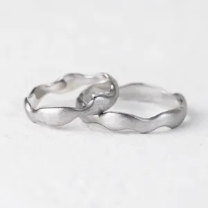 GOCCIO unusual wedding rings in an irregular curved shape