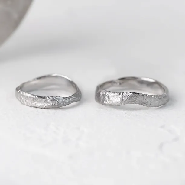 MUSK irregular gold wedding bands shown separately with textured surfaces